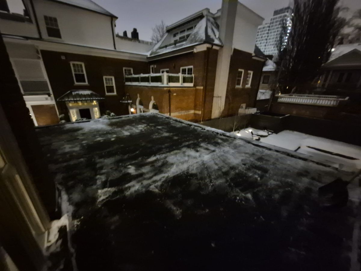 Flat roof over Toronto row houses with the snow shovelled off