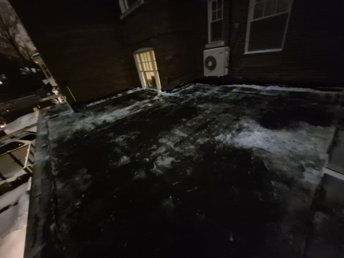 Rooftop terrace next to a door after the snow was cleared