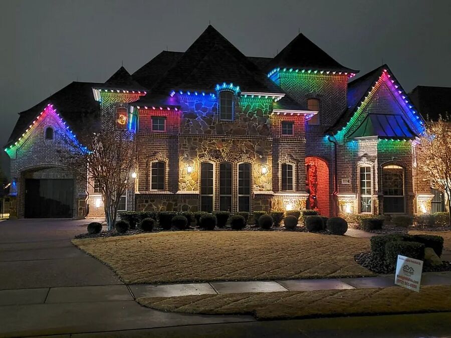 House with permanent multicolour lights along the roofline